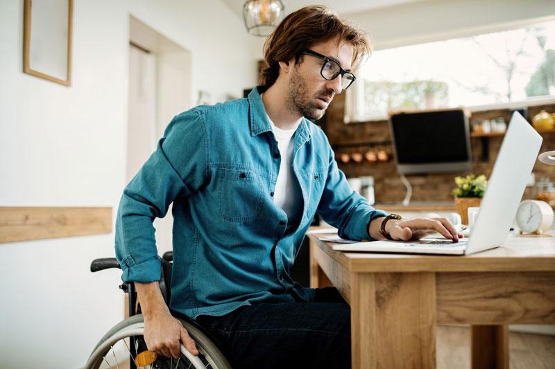 man using laptop at desk