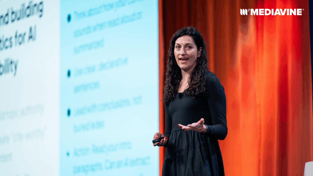 Photograph of Jaclyn Ranere of Evertune.AI onstage at MVCon 2025, giving her keynote on GEO.